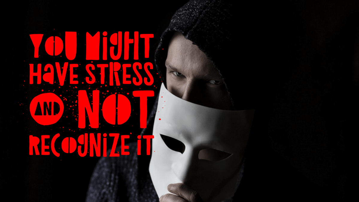 Masked person warns about hidden stress.