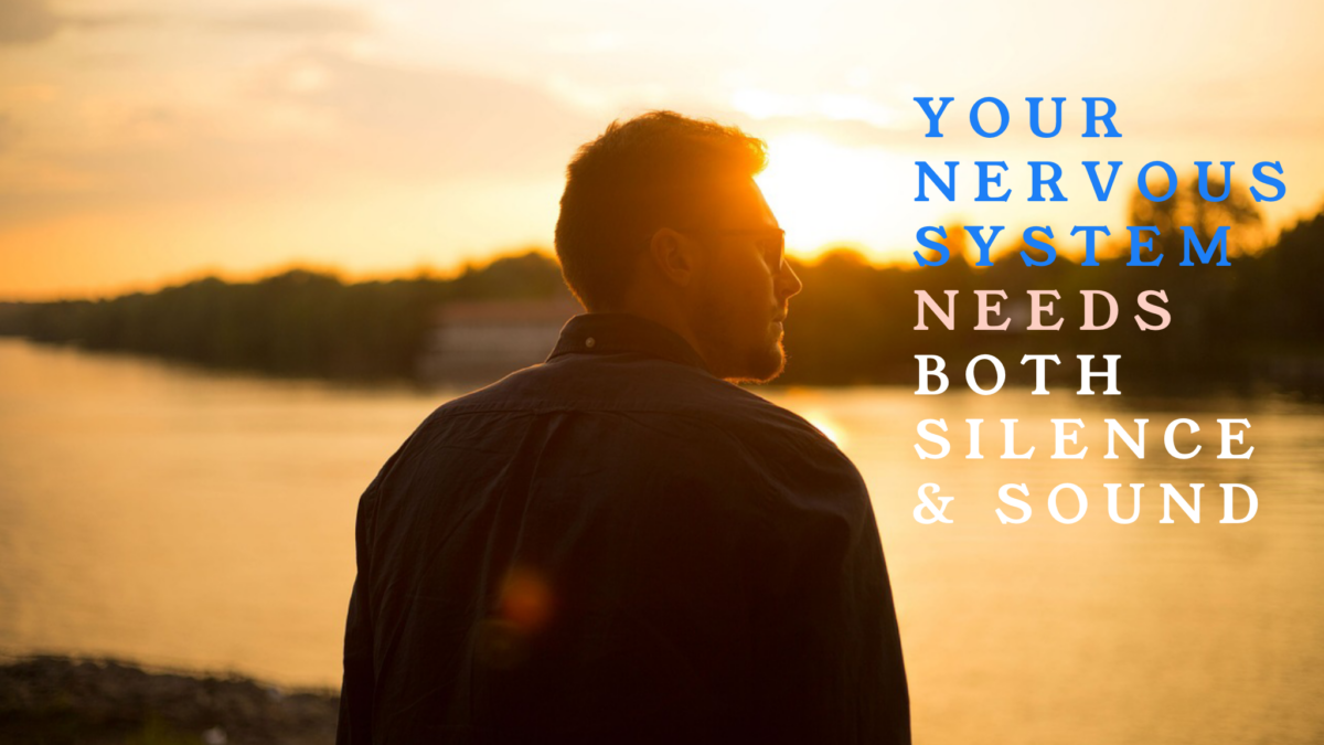 Silhouette of man by water at sunset with text.