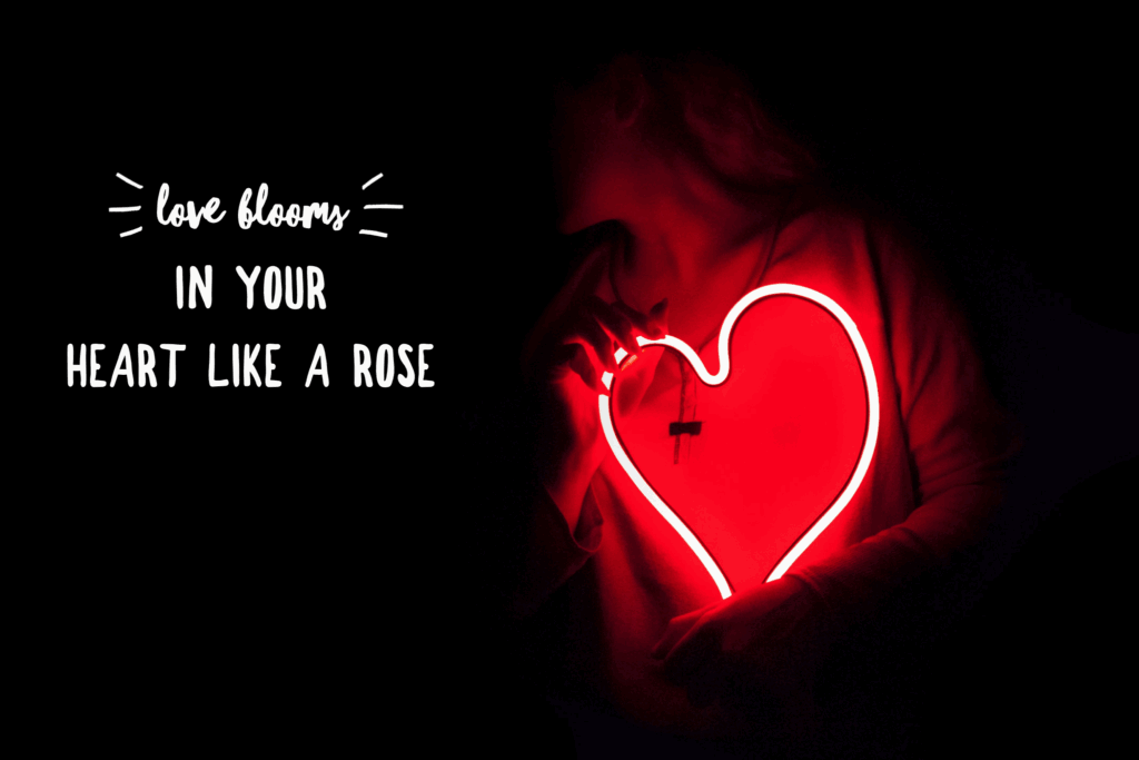Glowing heart with love blooms quote