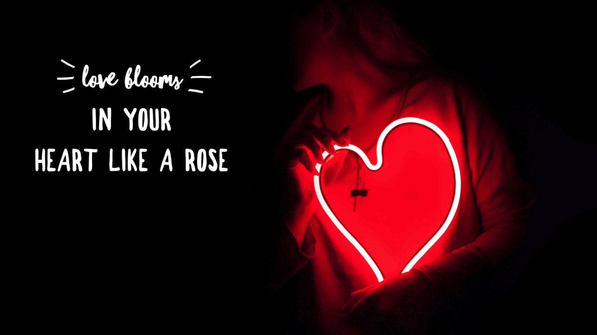 Glowing heart with love blooms quote