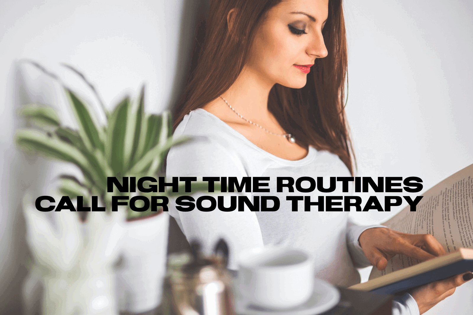 Woman reading book, plant, relaxing evening routine.