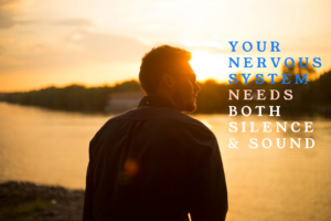 Silhouette of man by water at sunset with text.
