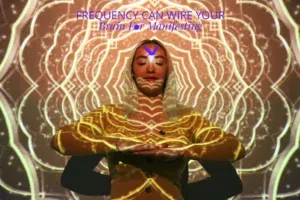 Person meditating with psychedelic projections.
