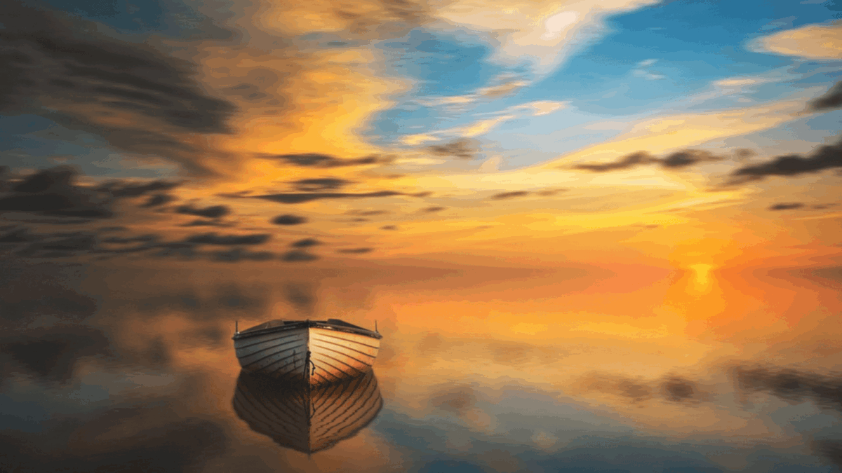 Boat on calm water at sunset.