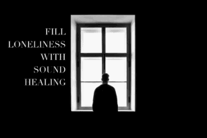 Person by window, text: Fill loneliness with sound healing.