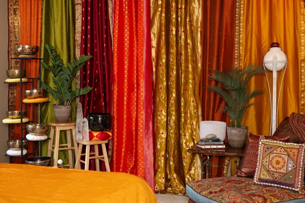 Aurras sound healing studio interior in Kansas City with sari curtains, singing bowls and crystal accents