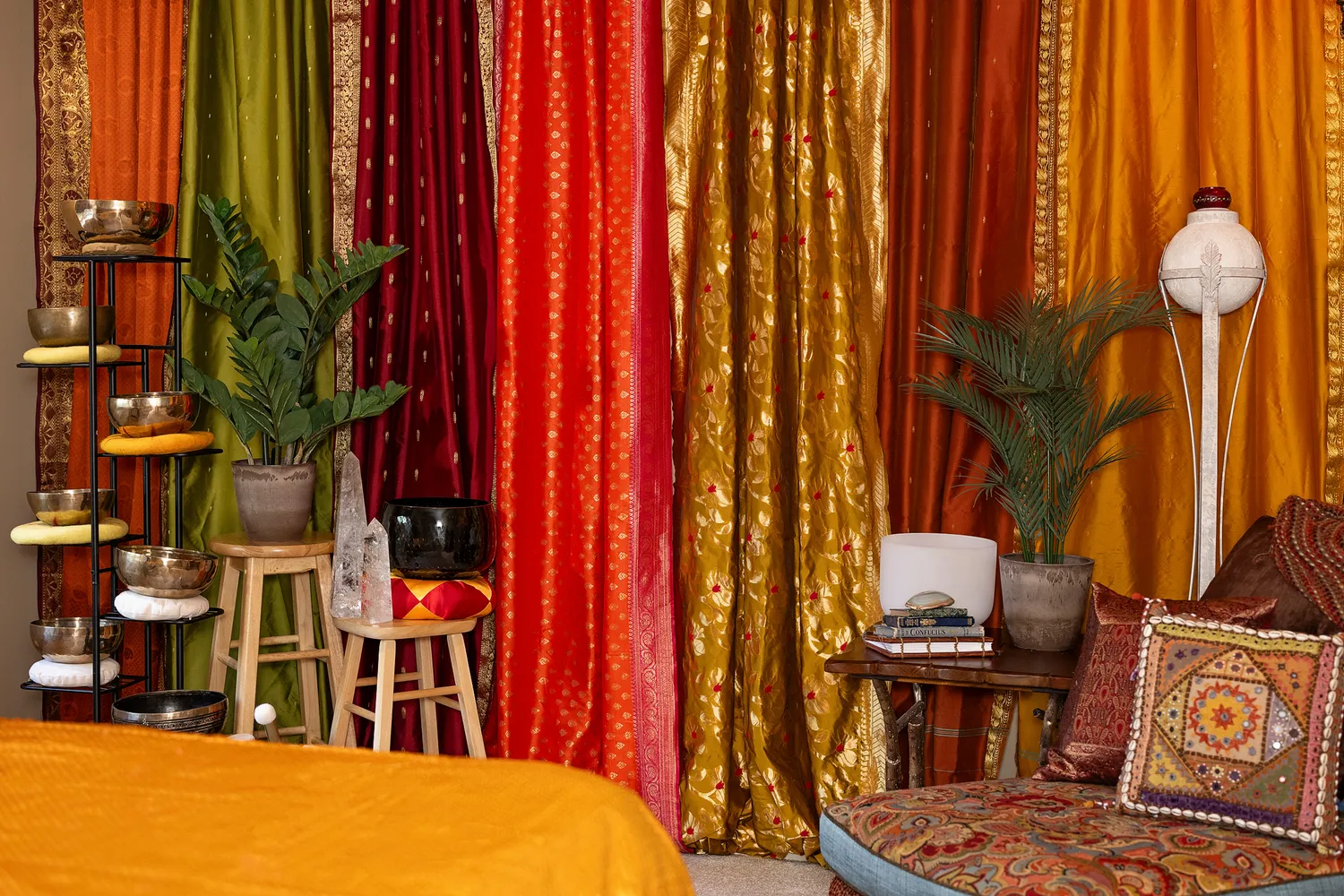 Aurras sound healing studio interior in Kansas City with sari curtains, singing bowls and crystal accents