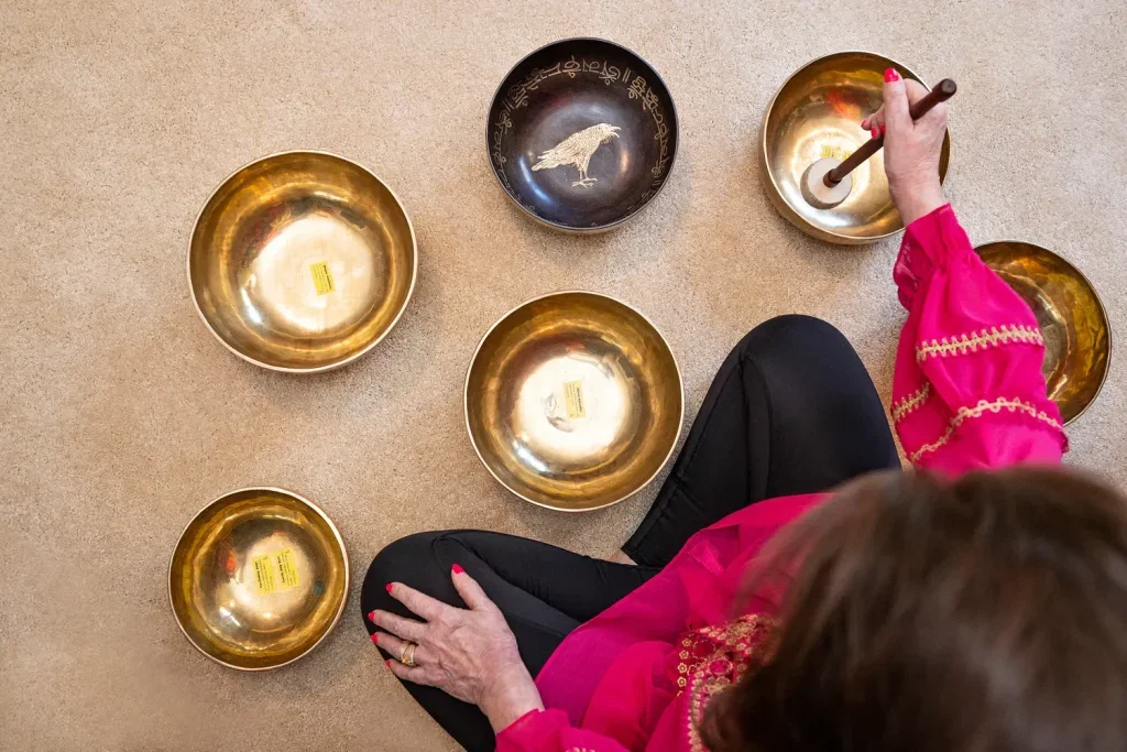 Overhead view of singing bowls arranged for a sound bath